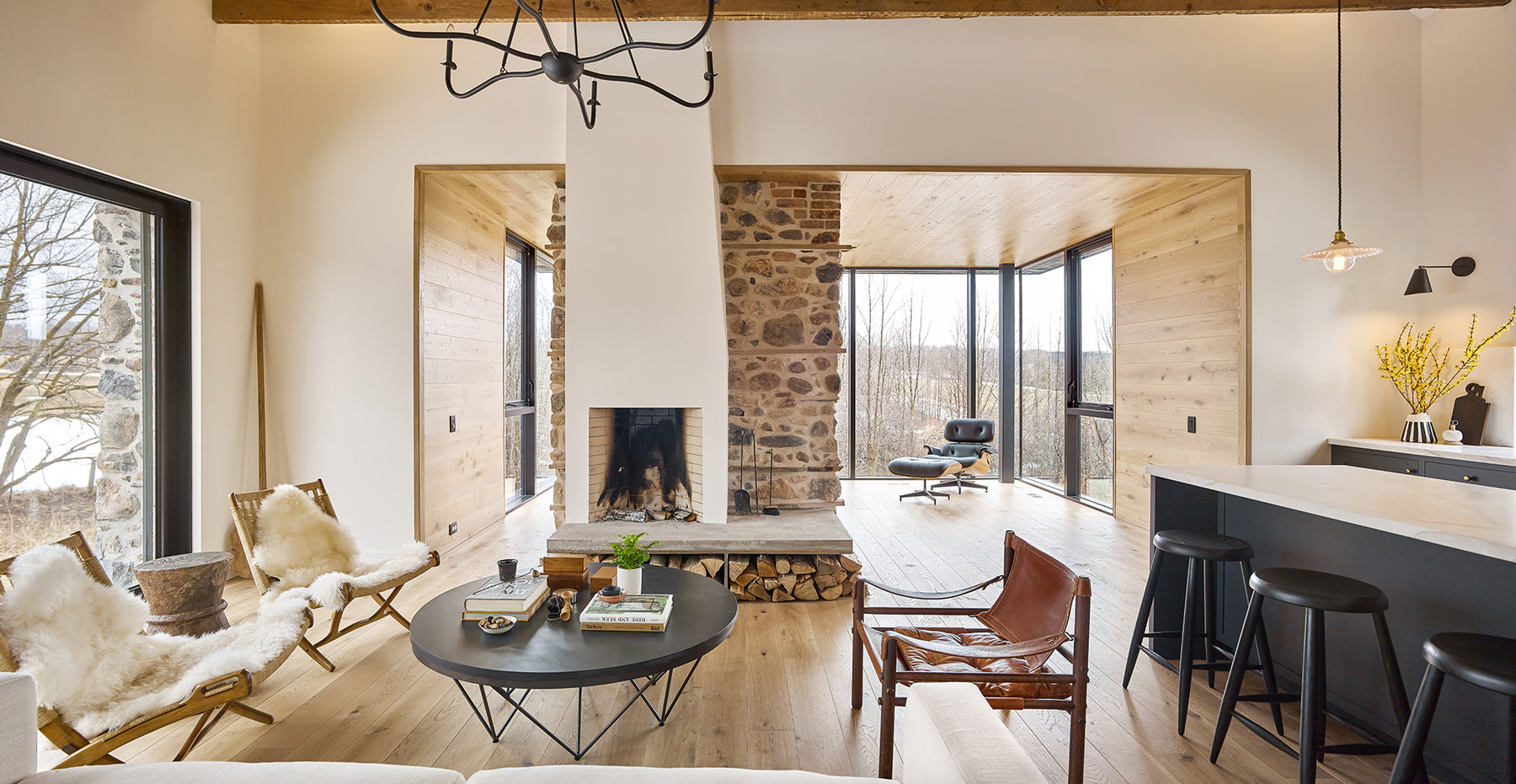 an interior view with midcentury modern furniture and northern wide wood planks on the floor