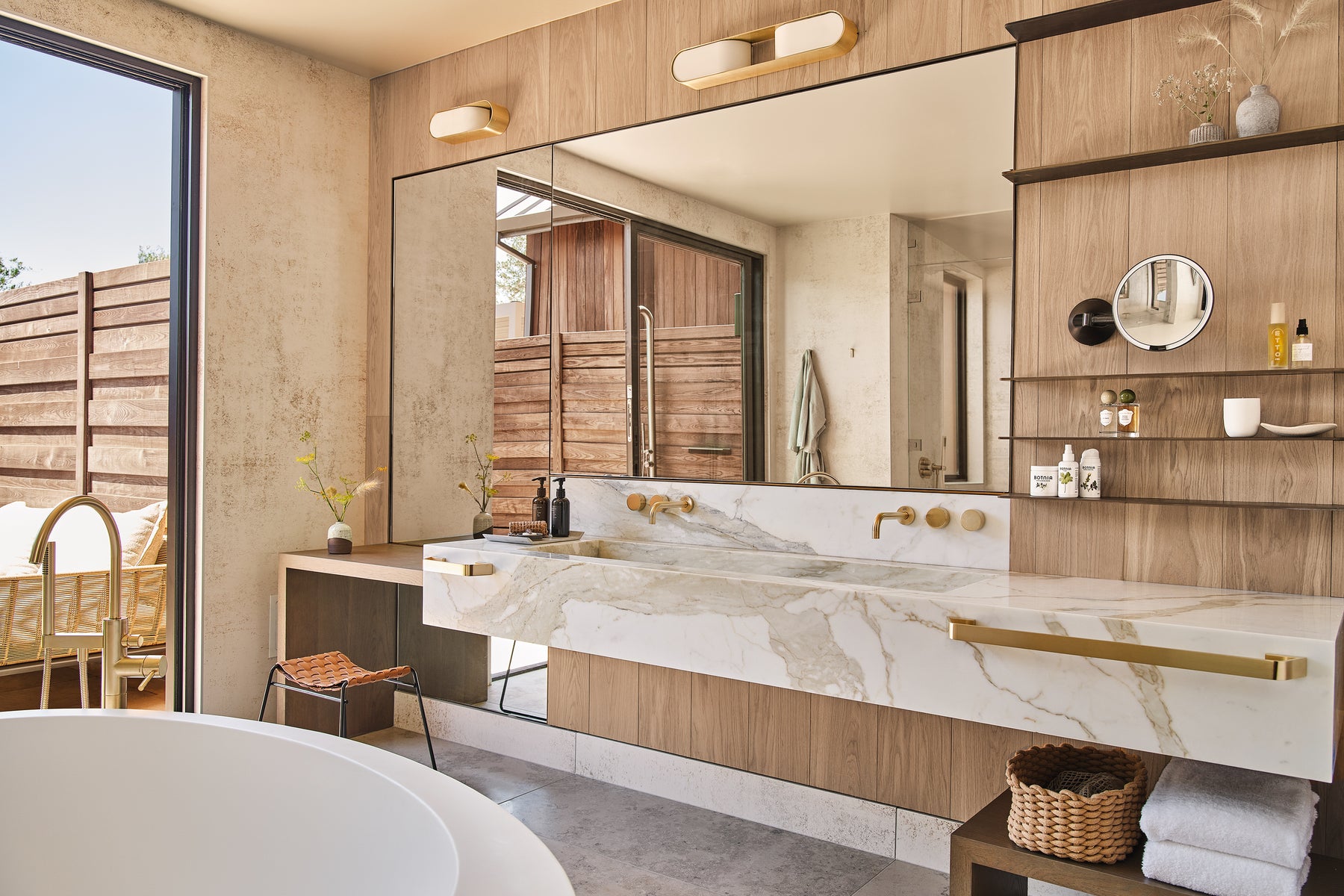 an interior view with midcentury modern furniture and northern wide wood planks on the floor