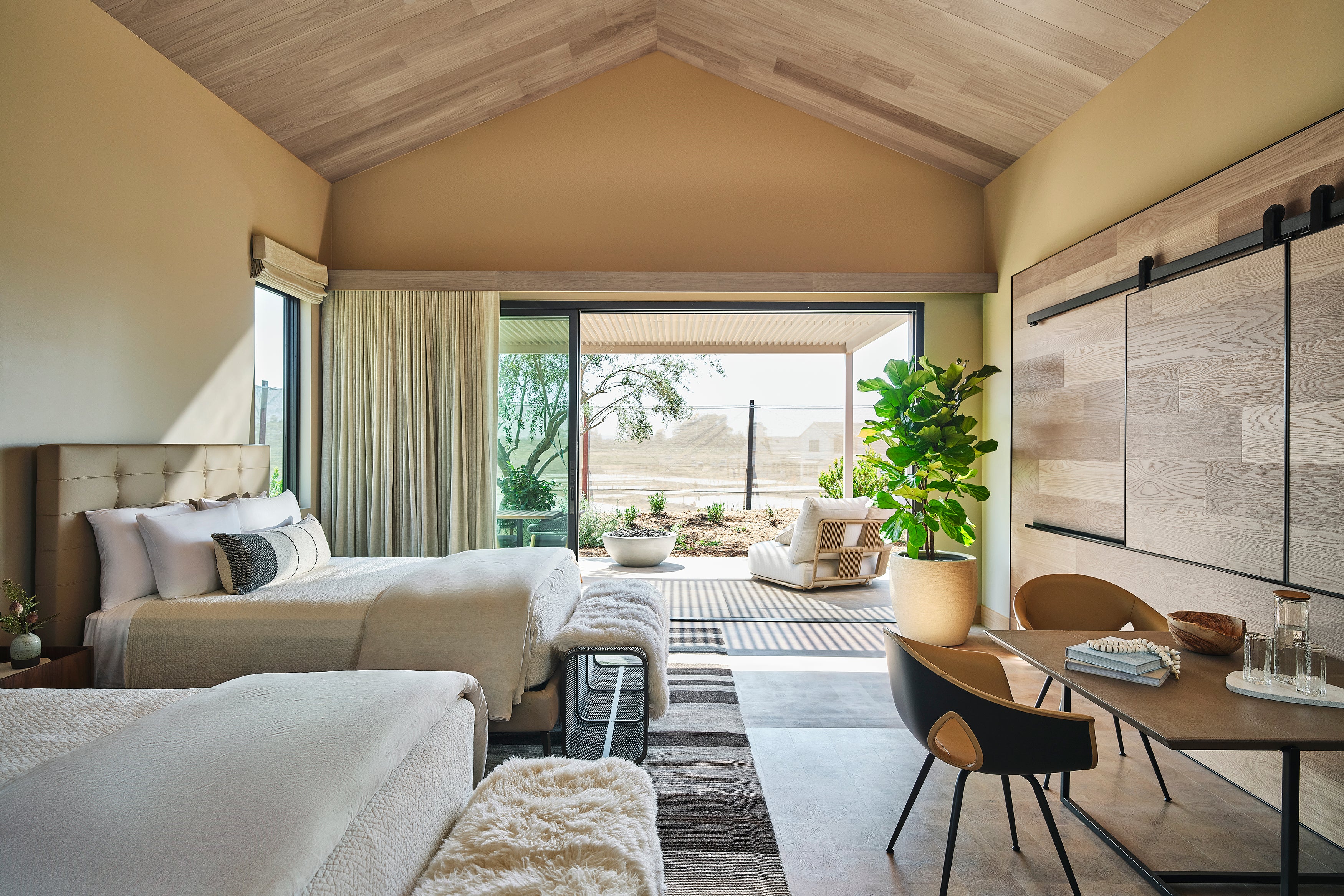 an interior view with midcentury modern furniture and northern wide wood planks on the floor