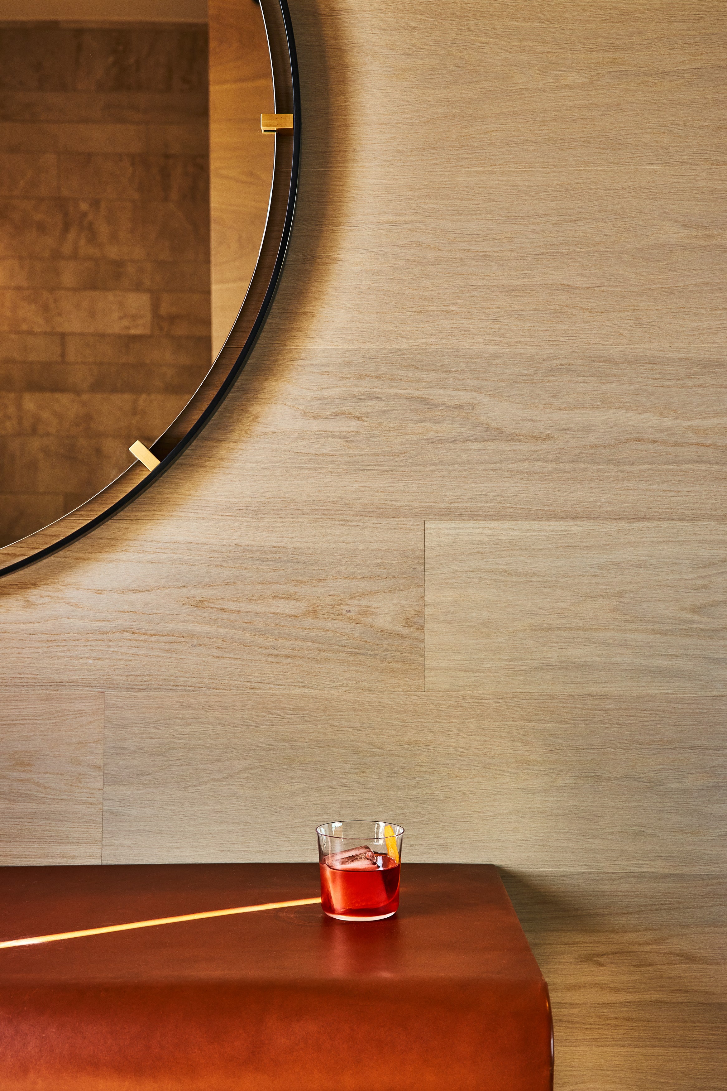 an interior view with midcentury modern furniture and northern wide wood planks on the floor