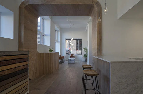 an interior view with midcentury modern furniture and northern wide wood planks on the floor