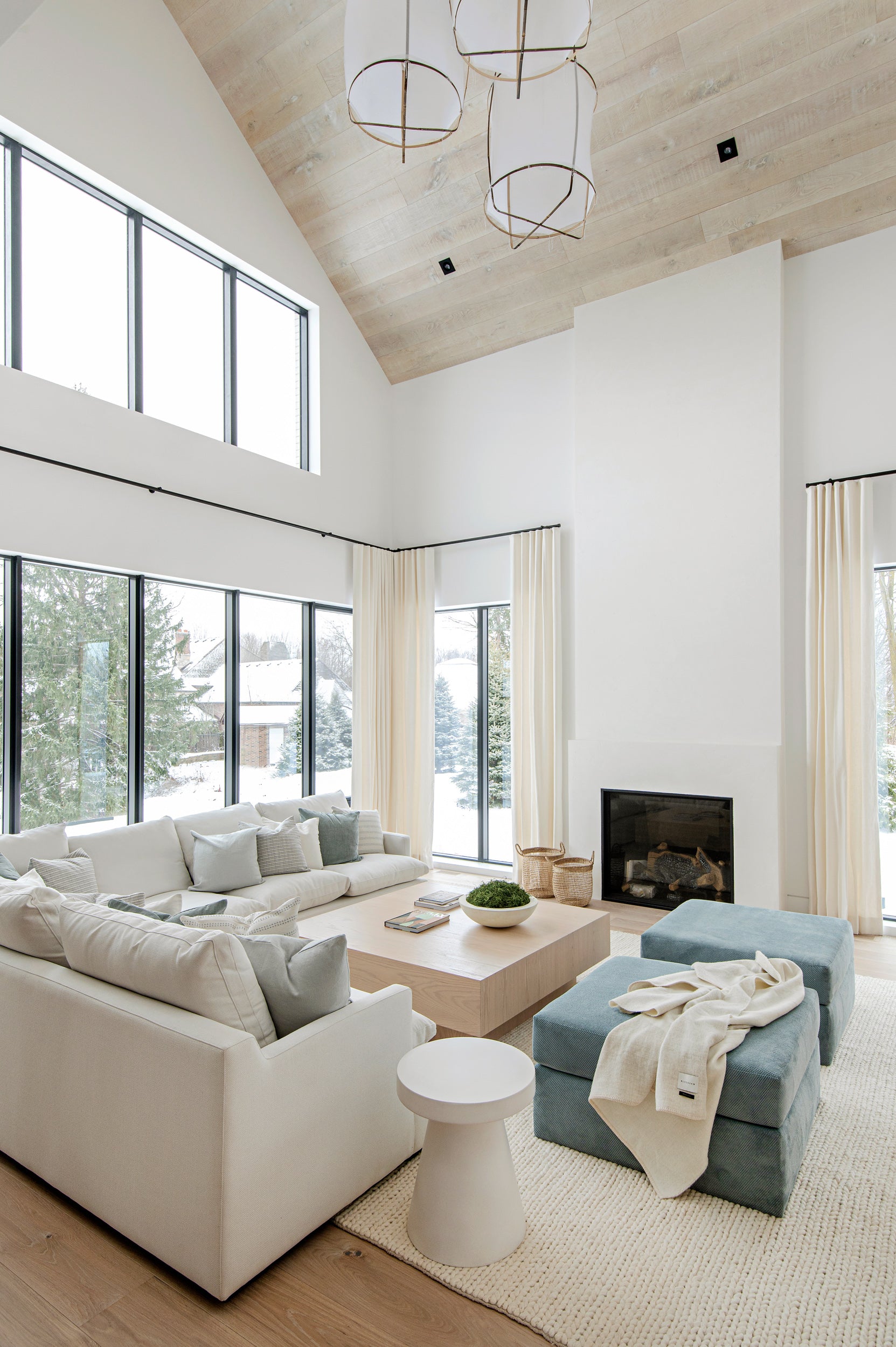 an interior view with midcentury modern furniture and northern wide wood planks on the floor