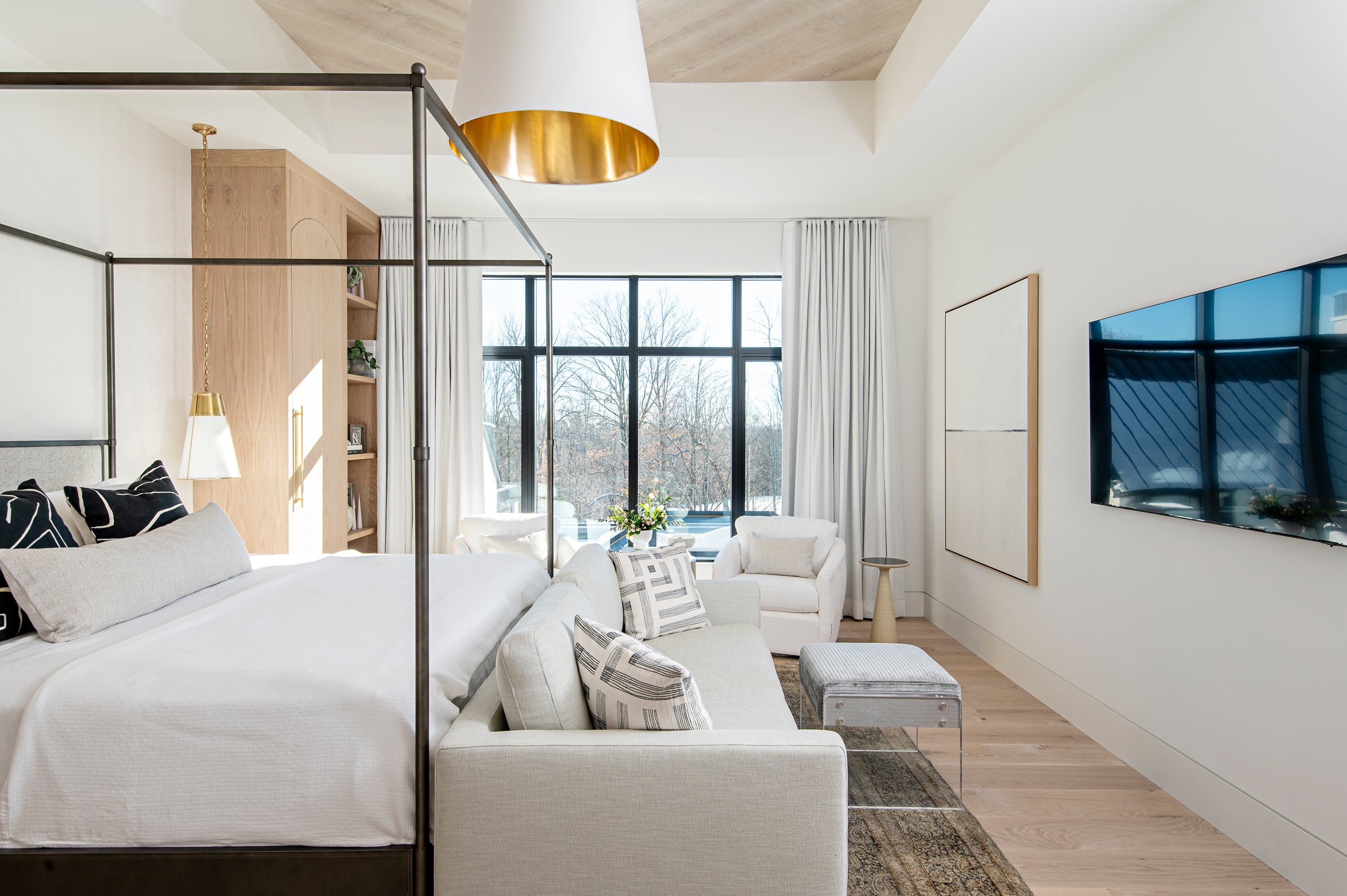 an interior view with midcentury modern furniture and northern wide wood planks on the floor