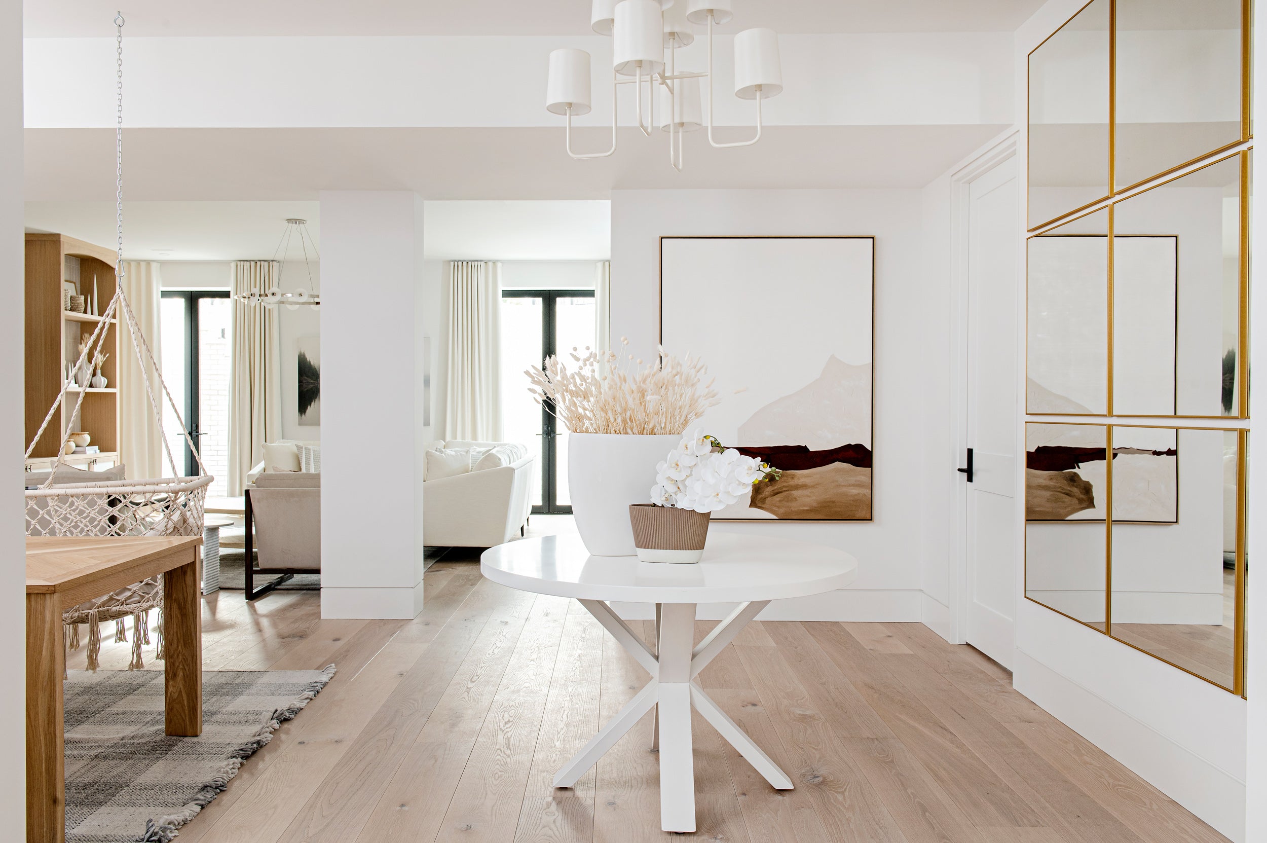 an interior view with midcentury modern furniture and northern wide wood planks on the floor