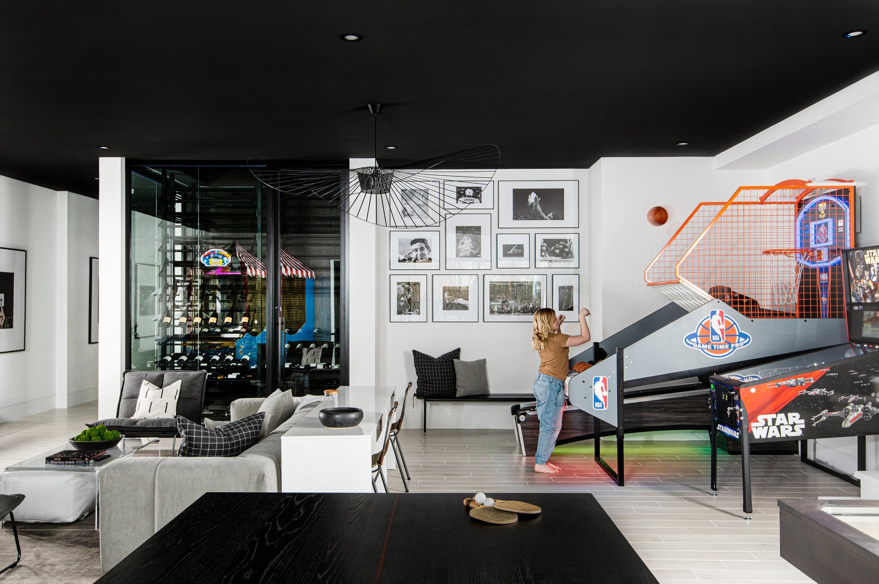 an interior view with midcentury modern furniture and northern wide wood planks on the floor