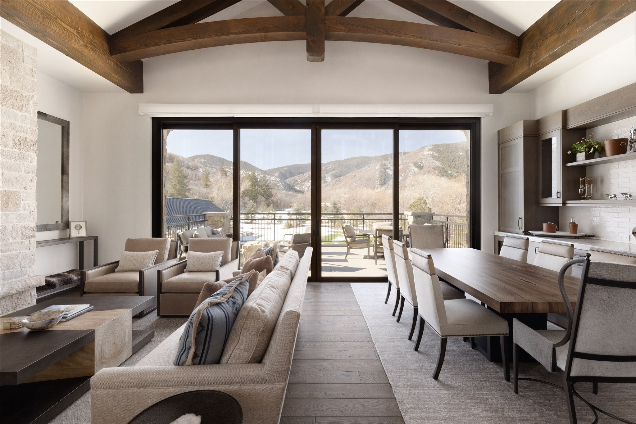 an interior view with midcentury modern furniture and northern wide wood planks on the floor