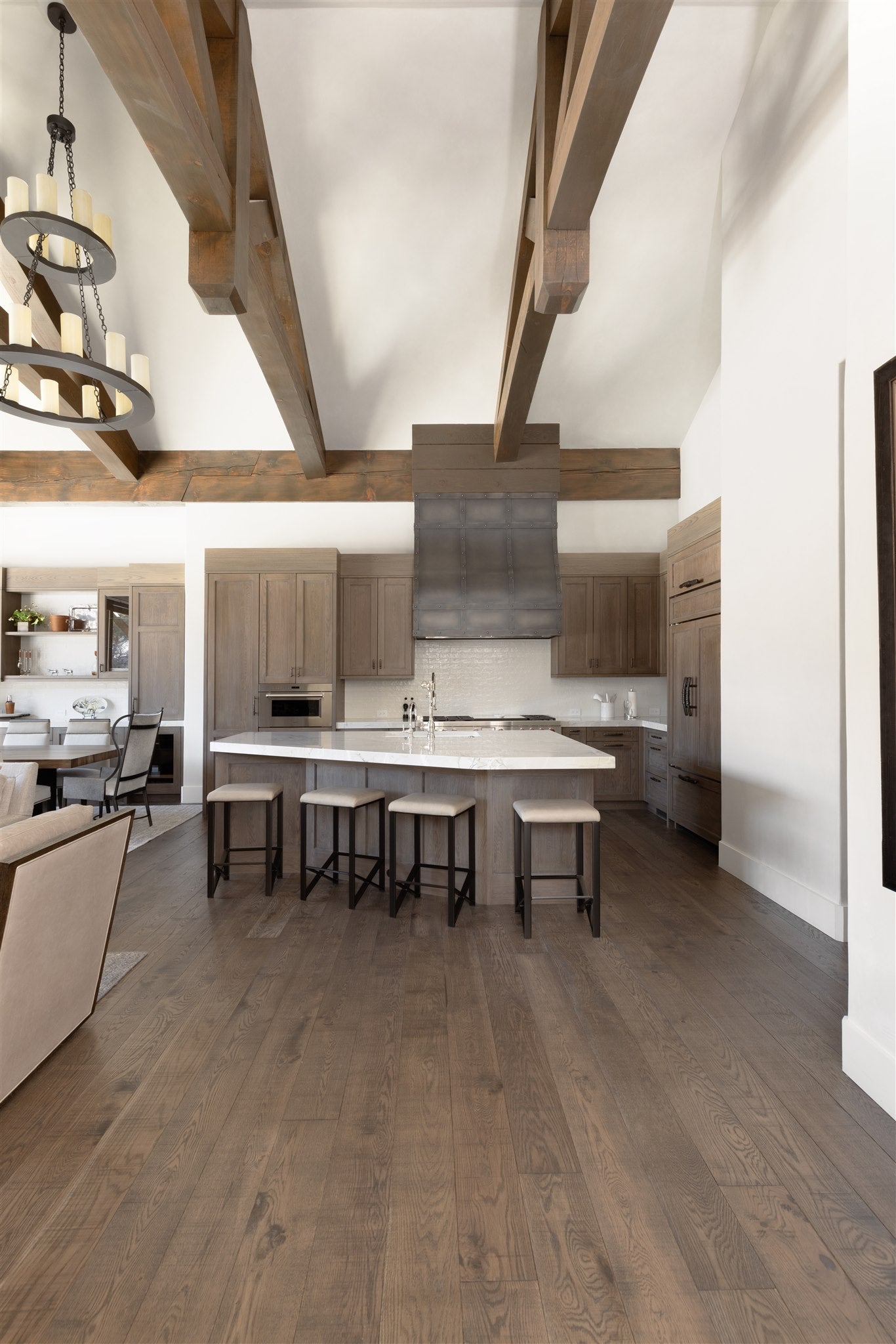 an interior view with midcentury modern furniture and northern wide wood planks on the floor